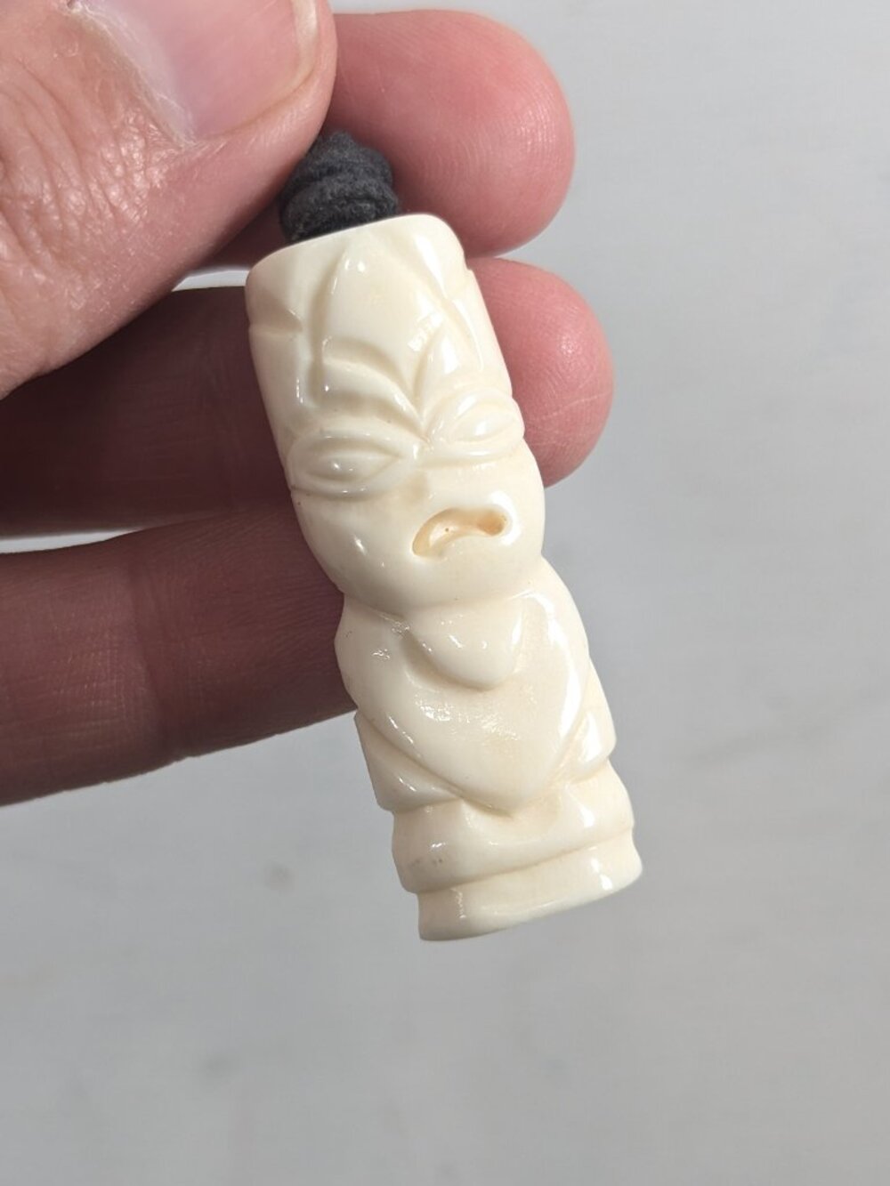 Bone carved Tiki Pendant on cord